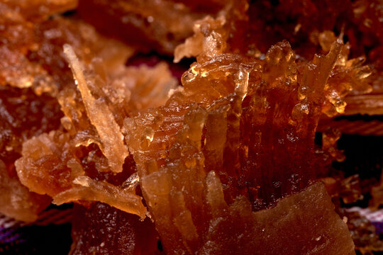 Close-up of traditional Salvadoran Chilacayote candy, a sweet, caramelized dessert enjoyed during festive August fairs.