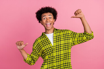 Portrait of nice young man point fingers self wear shirt isolated on pink color background