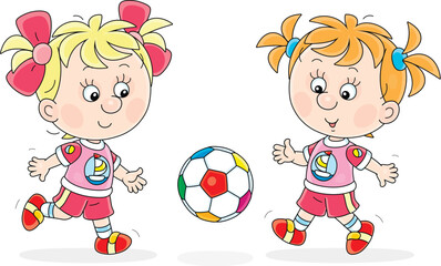 Funny little girls football players playing a ball during a match or train on a sports field, vector cartoon illustration isolated on a white background