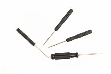Set of screwdrivers of different shapes and sizes on a white background