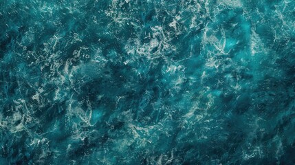 Obraz premium A person rides a surfboard through ocean waves