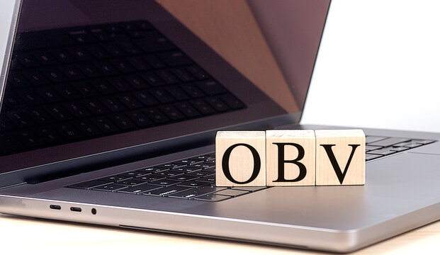 OBV word on wooden block on a laptop , business concept