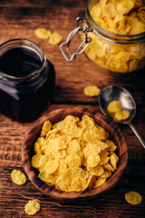 Breakfast with corn flakes, milk and jam