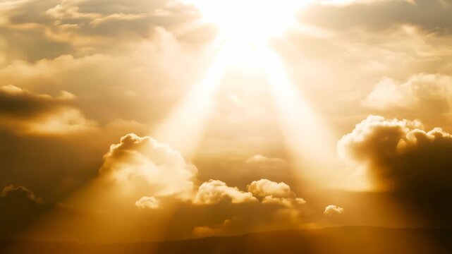 Sundown in yellow colors with sun behind the clouds and god rays of light