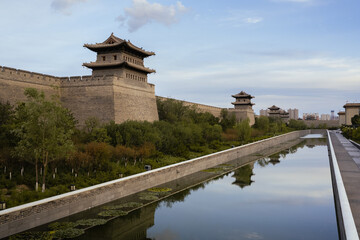 The ancient city wall located in Datong, Shanxi Province, China, stands tall and majestic, telling...