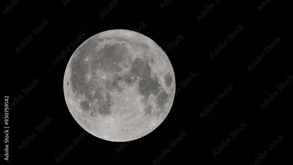 Wall mural full moon against a black night sky. close-up of the full moon illuminated against a pitch-black nig