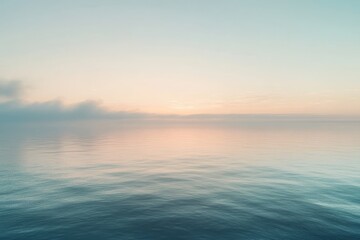 Obraz premium Soft, pastel-hued seascape with gentle waves and misty horizon blending sky and water