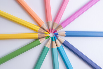 Fototapeta premium Colored pencils on colored background. Back to school concept. Draw
