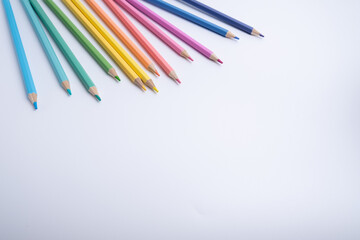 Colored pencils on colored background. Back to school concept. Draw