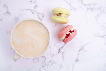Macarons on a colored background, French cookies. Gift for March 8, International Women's Day, Valentine's Day. Sweets for coffee and tea