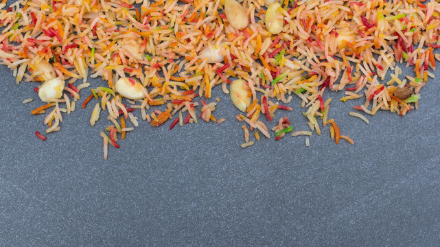 Colourful Pakistani Zarda rice on grey background