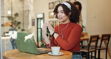 Video call, talking and woman on laptop in cafe for remote work opportunity, discussion or virtual meeting. Customer, entrepreneur or freelancer in earphones speaking in job interview in coffee shop