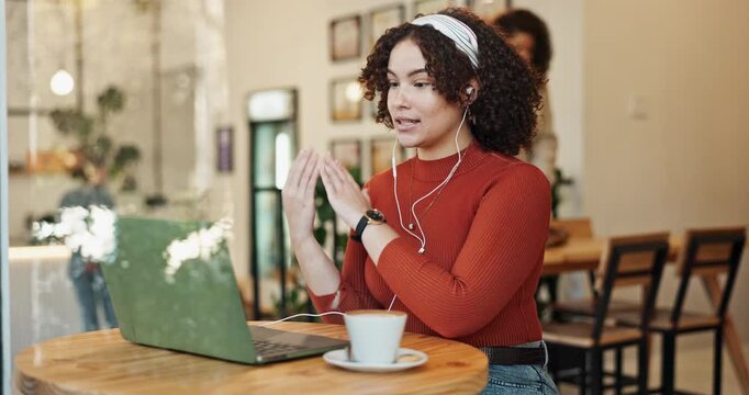 Video call, talking and woman on laptop in cafe for remote work opportunity, discussion or virtual meeting. Customer, entrepreneur or freelancer in earphones speaking in job interview in coffee shop
