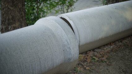 large asbestos cement pipes on the ground