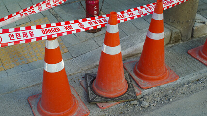 Safety barricade tape with traffic cones