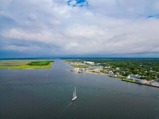 Above sailboat returning to port