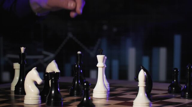 young businessman planning business strategy, male hand making move with chess piece on chessboard