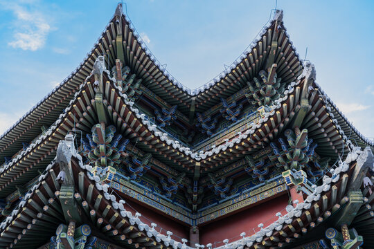 The elaborate eaves and intricate dougong brackets adorn the archway of the ancient city wall of datong, shanxi province, china.