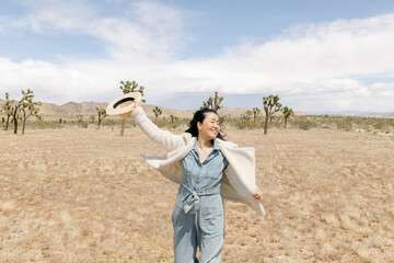 Woman dancing in joshua tree national park