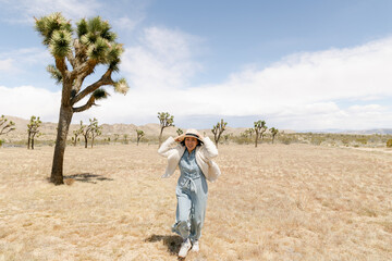 Woman dancing in joshua tree national park