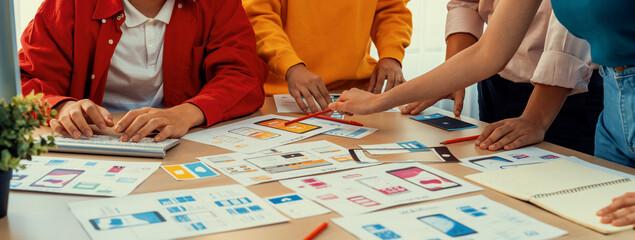 Panorama banner of startup company employee planning on user interface prototype for mobile application or website in office. UX UI designer brainstorm user friendly interface plan. Synergic