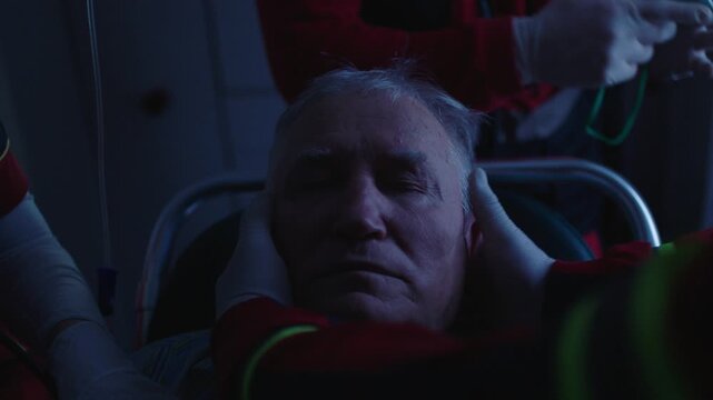 Injured elderly person getting first aid