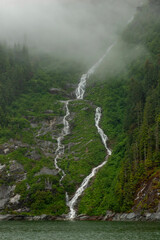 waterfall splitting into two falls and then combining into one in alaska
