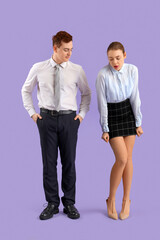 Business woman in short skirt and her male colleague on lilac background. Harassment concept