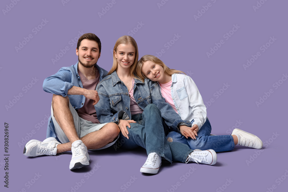 Poster happy family in stylish denim clothes sitting on purple background