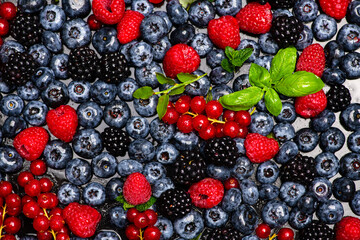Background of fresh berries. Berry fruit. Blueberries, blackberries and raspberries. Vitamins in natural products. Berries.
