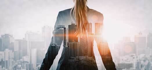 Double Exposure Image of Business Person on modern city background. Future business and communication technology concept. Surreal futuristic cityscape and abstract multiple exposure interface. uds