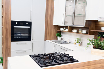 Home kitchen with white cabinets and an island