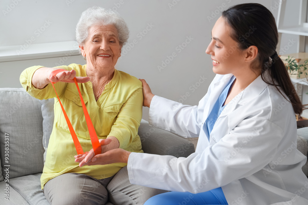 Sticker senior woman with stretching band and physical therapist at home