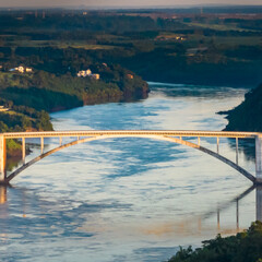 Border between Brazil and Paraguay and connects Foz do Iguacu to Ciudad del Este. Ponte da Amizade in Foz do Iguacu. Aerial view of the Friendship Bridge with Parana river.