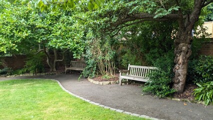 Public well maintained park in England in the summer to recover