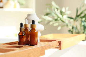 Cosmetic bottles on stand in interior of bathroom. Closeup