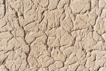 Texture of earth and adobe wall with cracks and grooves in the Andes mountain range