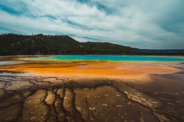 Landscape photography of the beautiful Grand Prismatic Spring hot springs in Yellowstone.