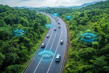 Fototapeta premium Autonomous vehicles driving on a forested highway demonstrating the future of eco friendly transportation solutions