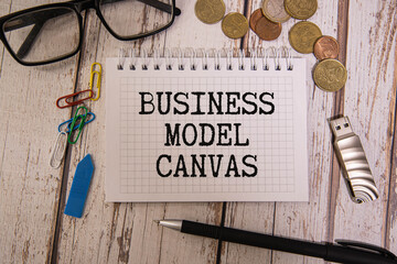 Business model canvas, Concept, Wooden blocks with slogan business model canvas.