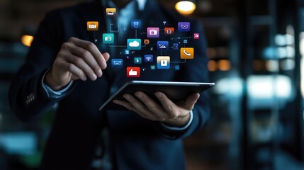 Digital overlay of app icons surrounding a businessman using a tablet, highlighting the importance of mobile apps in today fast-paced business world.