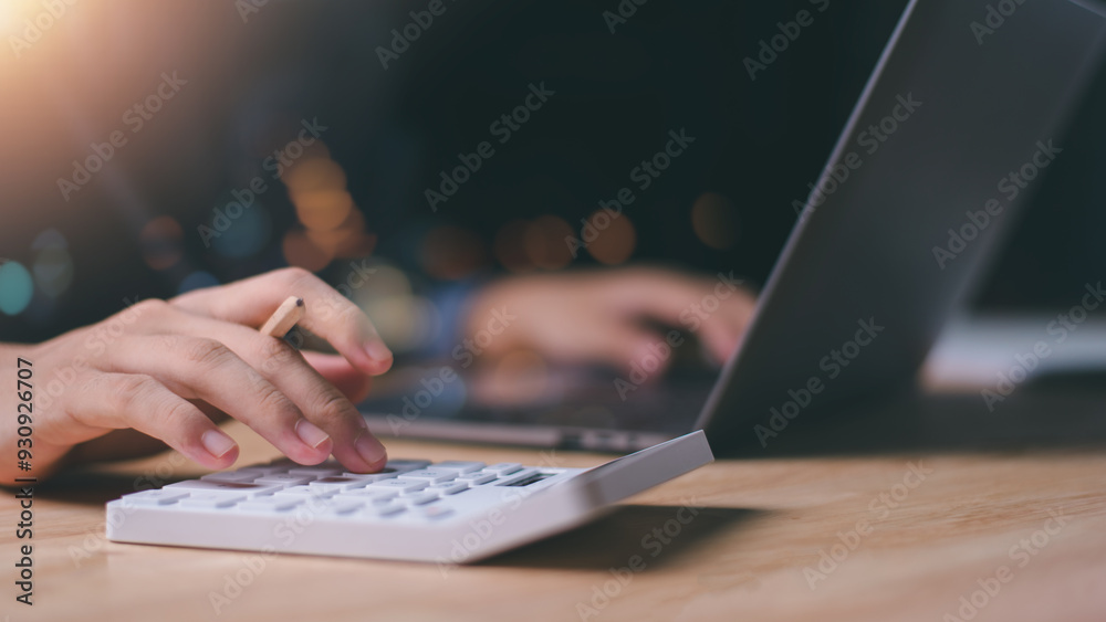 Aufkleber businessman using a calculator to calculate numbers ,profit and loss statement review of company per
