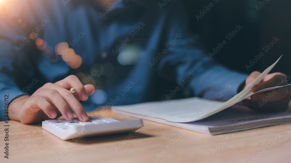 Aufkleber businessman using a calculator to calculate numbers ,profit and loss statement review of company per