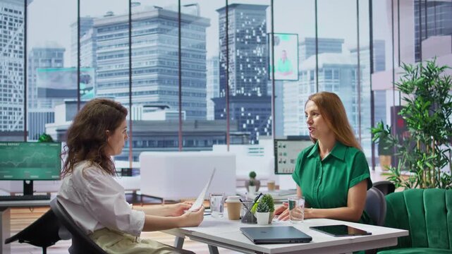 Human resources manager conducts interview with job seeker in modern office, discussing long term career goals and qualifications for the vacant position within the company. Recruitment. Camera B.