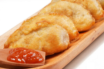 Fried stuffed Cireng, a traditional Indonesian snack filled with seasoned beef fat or jando,...
