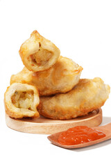 Fried stuffed Cireng, a traditional Indonesian snack filled with seasoned beef fat or jando, perfect with chili sauce dip, photographed against a white background.
