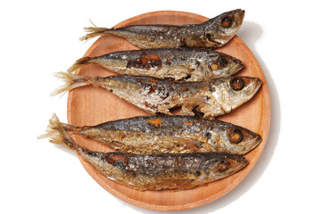 Fried Gereh Keranjang (pindang keranjang) fish, a traditional Indonesian side dish, served on a wooden plate and photographed with a white background.