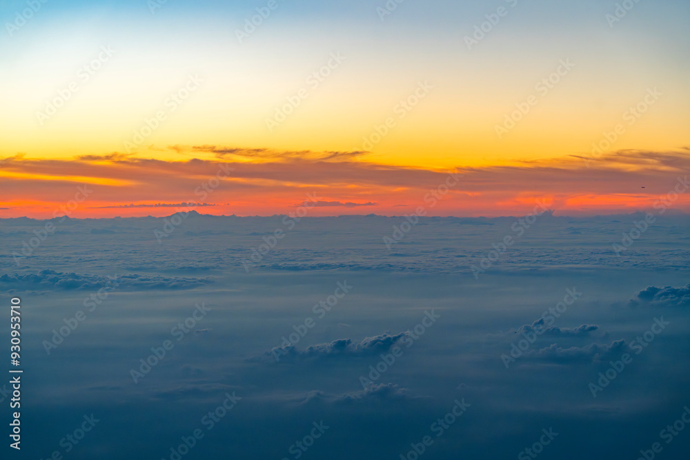 Wall mural aerial view of cloud and twilight sky after sunset from airplane