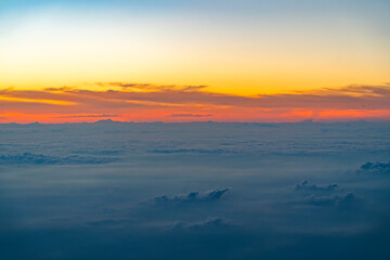 aerial view of cloud and twilight sky after sunset from airplane