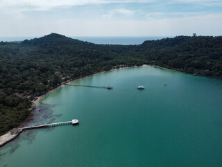 Aerial view of the Bang Bao bay with calm turquoise water and the ocean in the background in Koh...